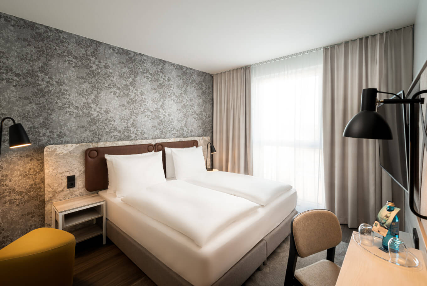 Stay in a standard double room at Arthotel ANA Amber Rostock.