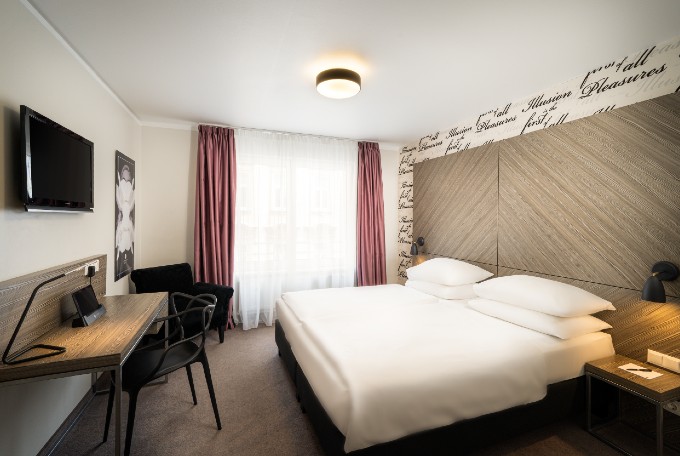 Double bed in superior double room at Arthotel ANA Boutique Six Vienna.